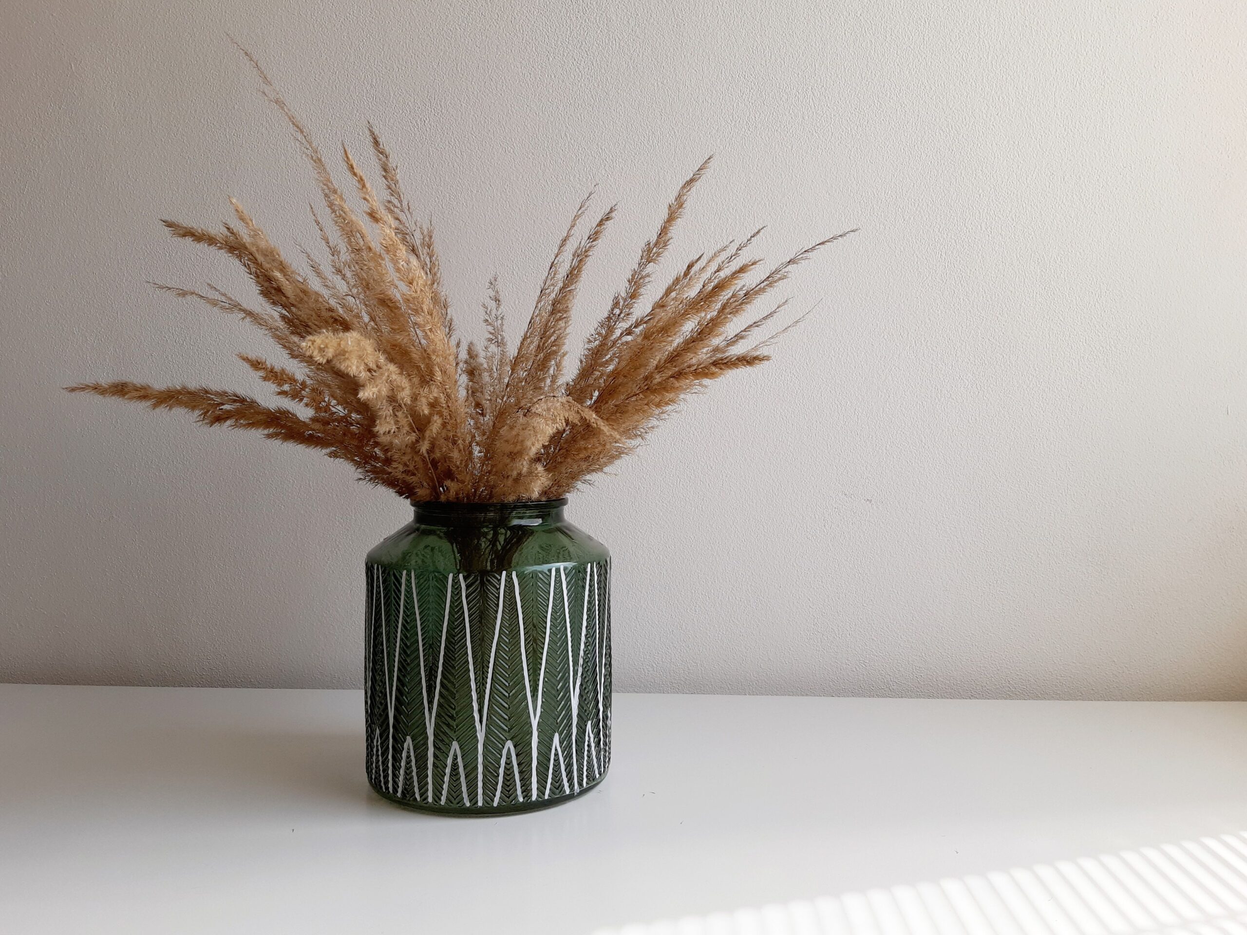 Bohemian interior vignette featuring cream, terracotta, sage, ochre and walnut colors